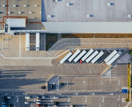 A top down view of a warehouse and carpark
